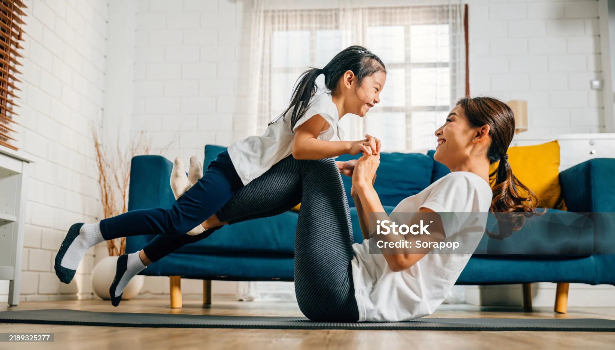 A multigenerational family laughing together outdoors